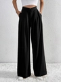 Detail of high-waist black wide-leg trousers featuring a unique V-cross waistband design - S / Black