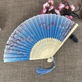 Chinese style folding fan with blue gradient cherry blossom patterns and blue tassel - No.66 Blue Gradient Cherry Butterfly