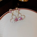 Pink heart crystal earrings with gold plating and cubic zirconia on a ceramic tray - Heart Spar Style