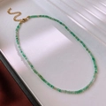 Macro shot of green bead necklace with golden lobster clasp on a textured background - Green Round Bead Necklace(28#)