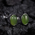 Close-up of S925 sterling silver oval jasper stud earrings on a dark charcoal surface - Natural Jasper Oval Silver 5*7mm