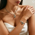 Chic silver-tone chain jewelry set with irregular dark gems and pearls on a female model - Antique Silver Pearl Necklace And Bracelet Set (01)