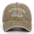 Macro shot of white 1965 Limited Edition embroidery on a vintage washed cotton baseball cap - Khaki