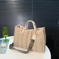 Beige quilted tote bag with ethnic style jacquard strap and gold hardware accents - Khaki