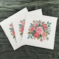 Disposable paper napkins with pink orange rose floral patterns on deep green fabric - Rose Bouquet
