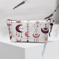 Detailed view of evil eye makeup bag with moon and sun patterns on white display - 42-White Bohemian Symbols