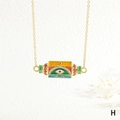 Detailed shot of hexagonal enamel pendant with evil eye motif and gold-plated chain - WILL/Evil Eye/Multicolor