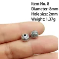 Macro shot of 8mm silver alloy cross bead showing diameter 8mm and 2mm aperture - 8# (Diameter 8mm Hole 2mm)