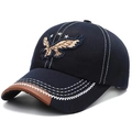 Men's navy baseball cap with eagle embroidery and brown leather trim on visor - Adjustable / Blue