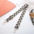 Macro shot of ethnic pattern strap with adjustable gold buckle and floral background - J44-A10-Beige Green Herringbone
