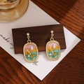 Detail of vintage enamel floral earring with pearls on a textured wooden stand - Colored Gradient Flower Pearl (E6202-1)