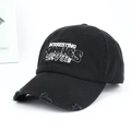 Detailed view of American vintage black distressed baseball cap with white embroidery lettering - Letter Embroidery Distressed Style / Black