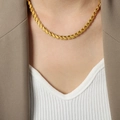 Minimalist golden leaf chain necklace worn by a model in a professional suit outfit - Wide 6.3mm Necklace (P1634) / Gold