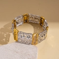 Macro shot of gold and silver links with engraved Faith and Hope text on a chain bracelet - Bracelet - Silver