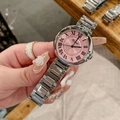 Detailed shot of a silver steel strap watch with pink Roman numeral dial on a model - Women's Pink Dial / Silver/Pink