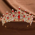 Golden bridal crown with red and white rhinestones on brown silk fabric background - Gold Red