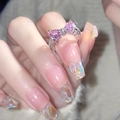 Pink heart bow cubic zirconia open ring in silver finish worn by a model - Pink Bowknot Full Zirconia Style(JZ0254)