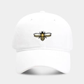 Front view of a white cotton baseball cap featuring detailed yellow honeybee embroidery - White