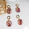 Gold hoop earrings with large baroque pearls featuring purple and pink iridescent luster - Square Baroque Universal Clasp