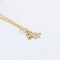 Golden necklace featuring a teddy bear pendant with inlaid oval clear zircon stone - White Zircon Bear