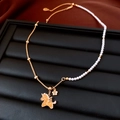 Detail of 18k gold plated necklace with pearls, unicorn pendant and FU tag charm - Necklace-Gold-White-Unicorn Style
