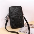 Black pebbled leather crossbody mobile phone bag with embossed camellia flower design - Black