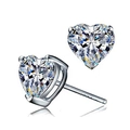 Detailed close-up of heart-shaped zircon stud earrings with three-prong silver setting - White Zirconia