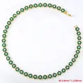 Detail of flower necklace with green cubic zirconia petals, 8mm width and 420mm length - Gold Green Zirconia Necklace (VL526)