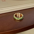 Adjustable gold ring with green and lime enamel geometric shapes on a wooden desk - Yellow Green Polygon Enamel (J3954)