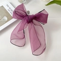 Elegant purple organza bow hair tie featuring a delicate black stitched edge finish - Fuschia