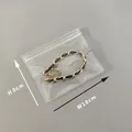 Braided gold chain and black leather bracelet in a 10x8cm clear plastic storage bag - 30 Micron 10x8cm Resealable / 100 Pcs/Pack