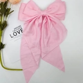 Elegant large pink satin double-layered bow hair clip on a minimalist decorative background - Pink