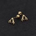 Macro detail of golden antler studs with secure screw-back ball closures for comfort - Antler / Gold