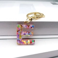 Detail of letter E resin keychain with colorful heart sequins and gold lobster clasp - Letter E Lobster Clasp Keychain