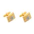 Macro detail of gold-tone rectangular cufflinks with blue and clear crystal inlay - Gold