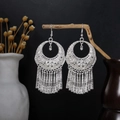 Ethnic Miao-style silver long tassel hoop earrings displayed on a rustic wood branch - Large Ring Tassel (E2643-2) / Silver