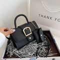 Black textured leather handbag with gold horseshoe buckle and matching mini pouch - Black