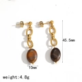 Macro shot of stainless steel drop earrings with tiger eye stone and 45.5mm size detail - Chain Oval Stone Style (TE60633)