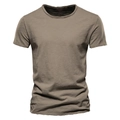 Detail shot of the textured slub cotton fabric and V-neckline of a men's t-shirt - S / Crew Neck / Camel