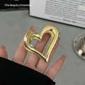 Elegant gold hollow heart hair claw clip made of polished metal for stylish hairstyles - Heart Hollow / Gold