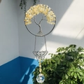 Detail of tree of life suncatcher with yellow crystals, metal butterfly and crystal ball - Citrine