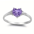 Detailed macro view of a heart-shaped purple gemstone ring with silver metal band and side diamonds - US 6 / Purple