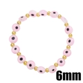 Dettaglio delle perle in vetro Evil Eye rosa da 6mm con distanziatori dorati sul bracciale - Rosa
