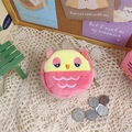 Close-up of a plush pink owl coin purse with embroidery details on a white lace background - Red Owl