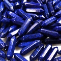 Macro shot of bulk dark blue lapis lazuli hexagonal points with natural textures - Lapis Lazuli