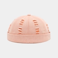 Detail view of pink docker hat featuring distressed ripped holes and orange lining - Adjustable / Orange