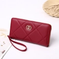 Detail of red quilted long wallet with golden double-ring clasp and wrist strap - 19X2.5X10 / Red