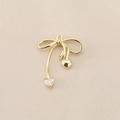 Macro detail of 18k gold plated bowknot pendant with polished heart and zircon stone - PJ0212-Gold Bowknot Heart