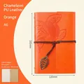 A6 orange PU leather refillable notebook with embossed leaf and bronze leaf pendant - Lined / Orange / A6