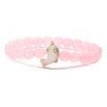 Detailed view of pink round beads with white ceramic dolphin pendant on elastic bracelet - Rose Quartz